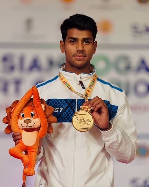 Dev Gohar with his gold medal at the Asian Yogasana championship