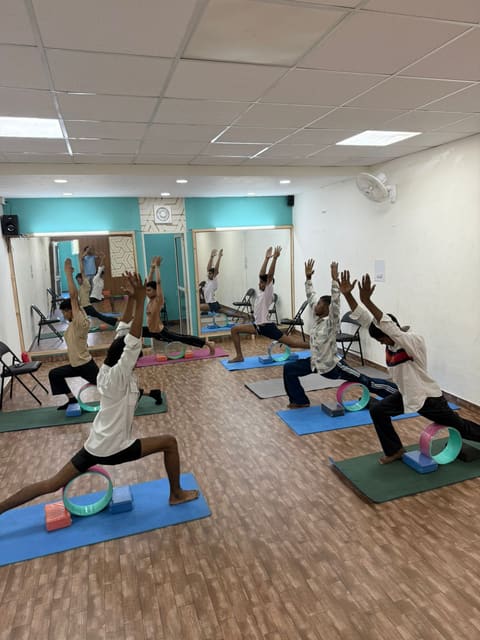 Group yoga class with yoga wheels at Yoga Se Hoga, Mohali
